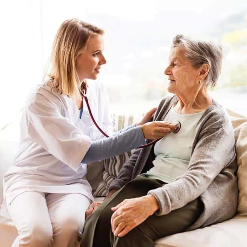 Doctor consultant providing home visit to elderly woman in Ranchi