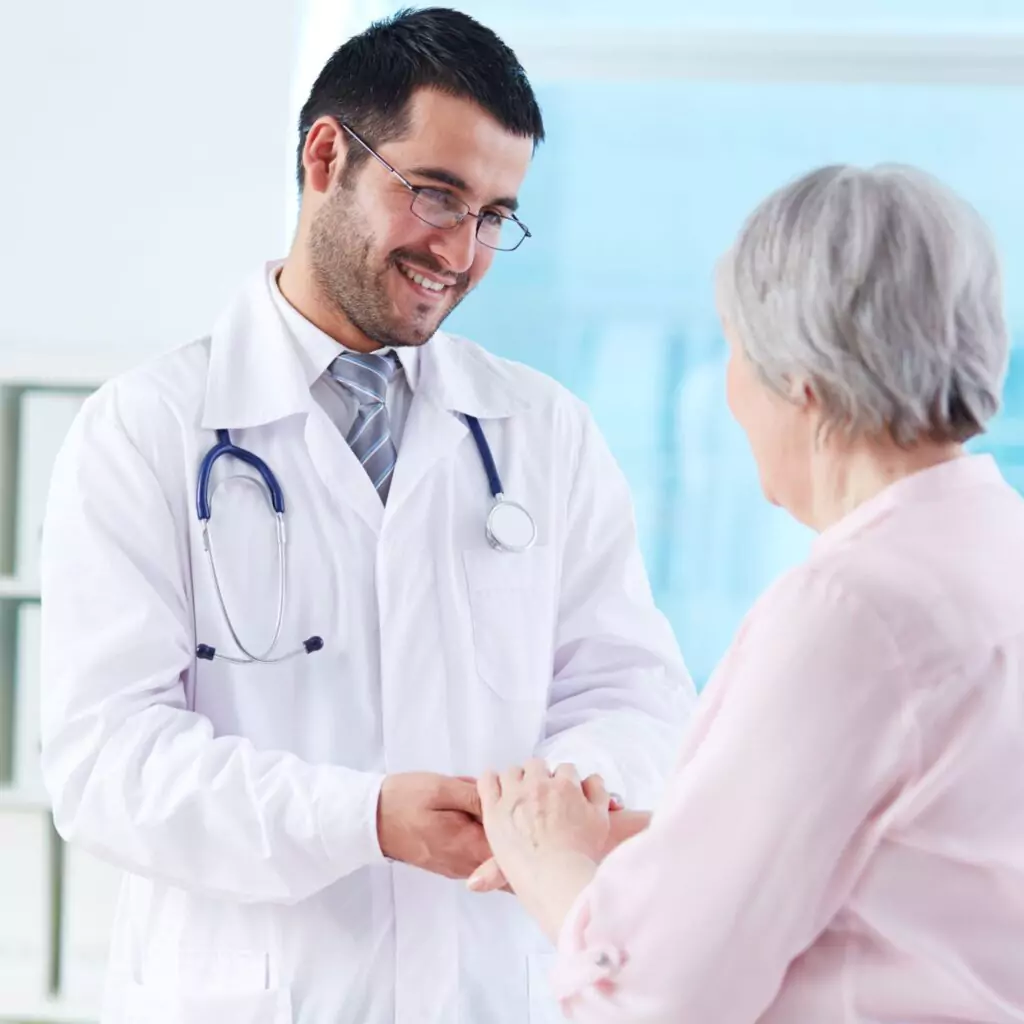 Doctor consultant greeting elderly woman during home visit in Ranchi. doctor at home, doctor consultation services, doctor home visits