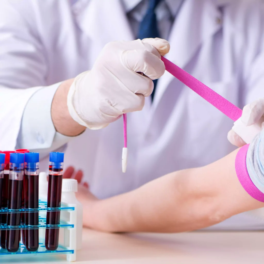 Woman receiving blood test at home in Ranchi, doctor collecting blood sample. medical checkup services at home