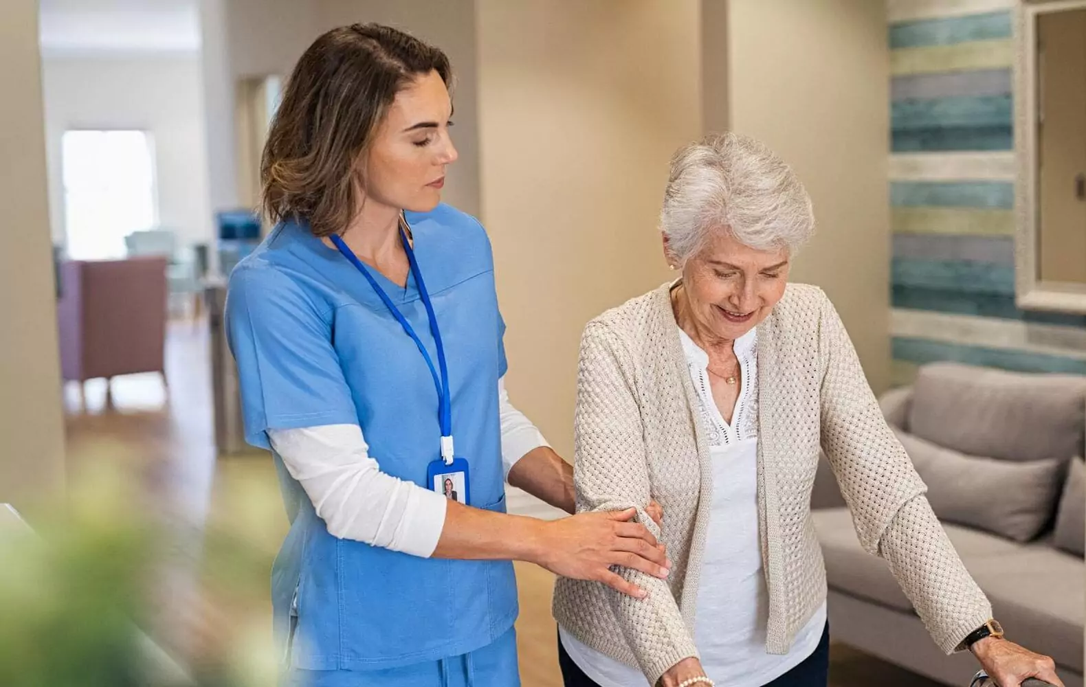 Patient care services in Ranchi: A nurse helping an elderly woman with her walker at home. nurse at home. home nursing services. nursing care at home