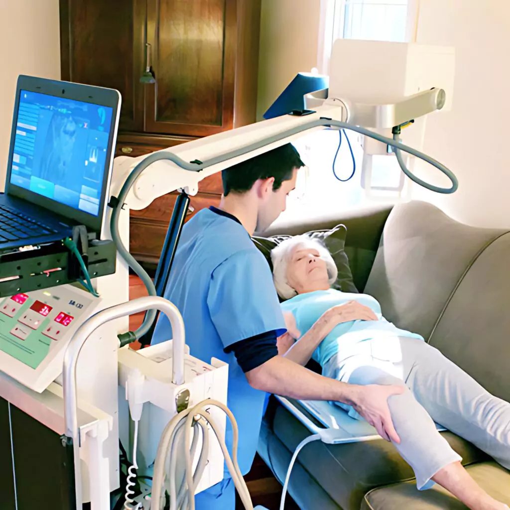 A man using a laptop for x-ray services at home in Ranchi. X-ray services by professional nurses in home Nursing care services